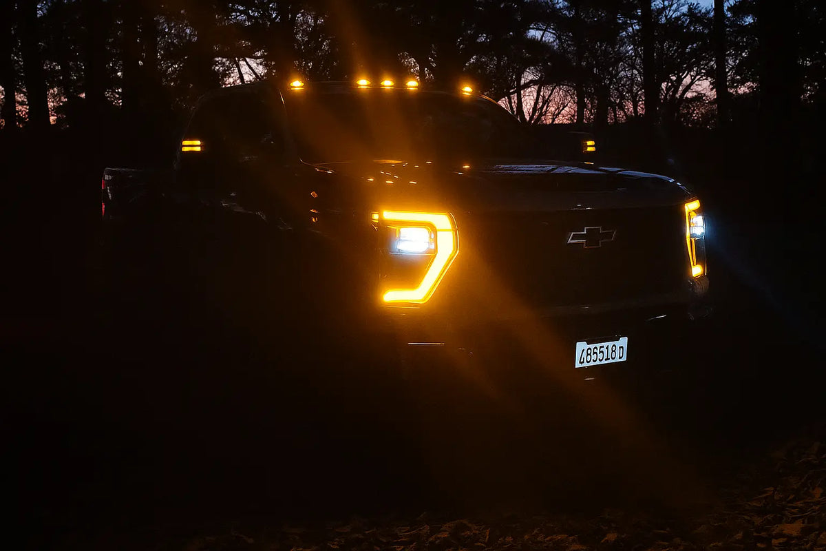 chevy silverado hd 2500 with amber lights at night